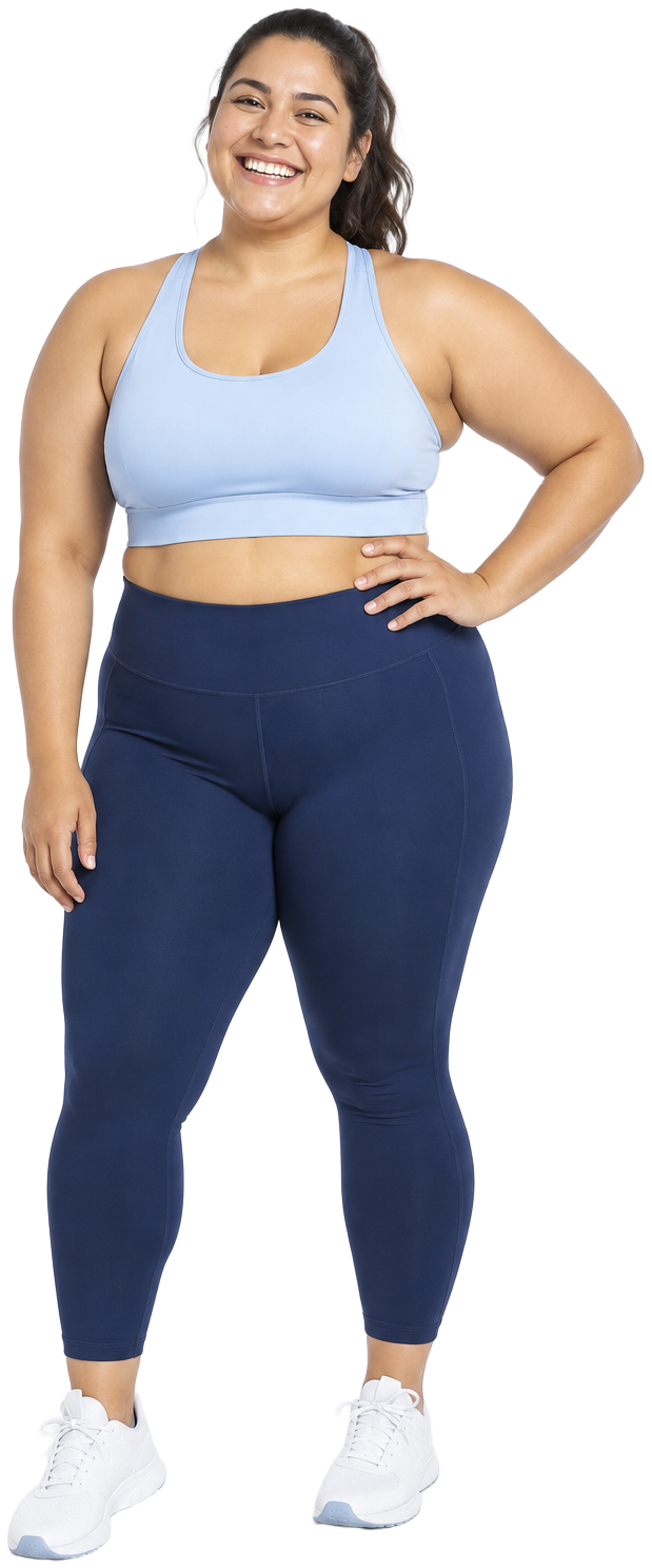 A smiling woman in athletic wear standing confidently